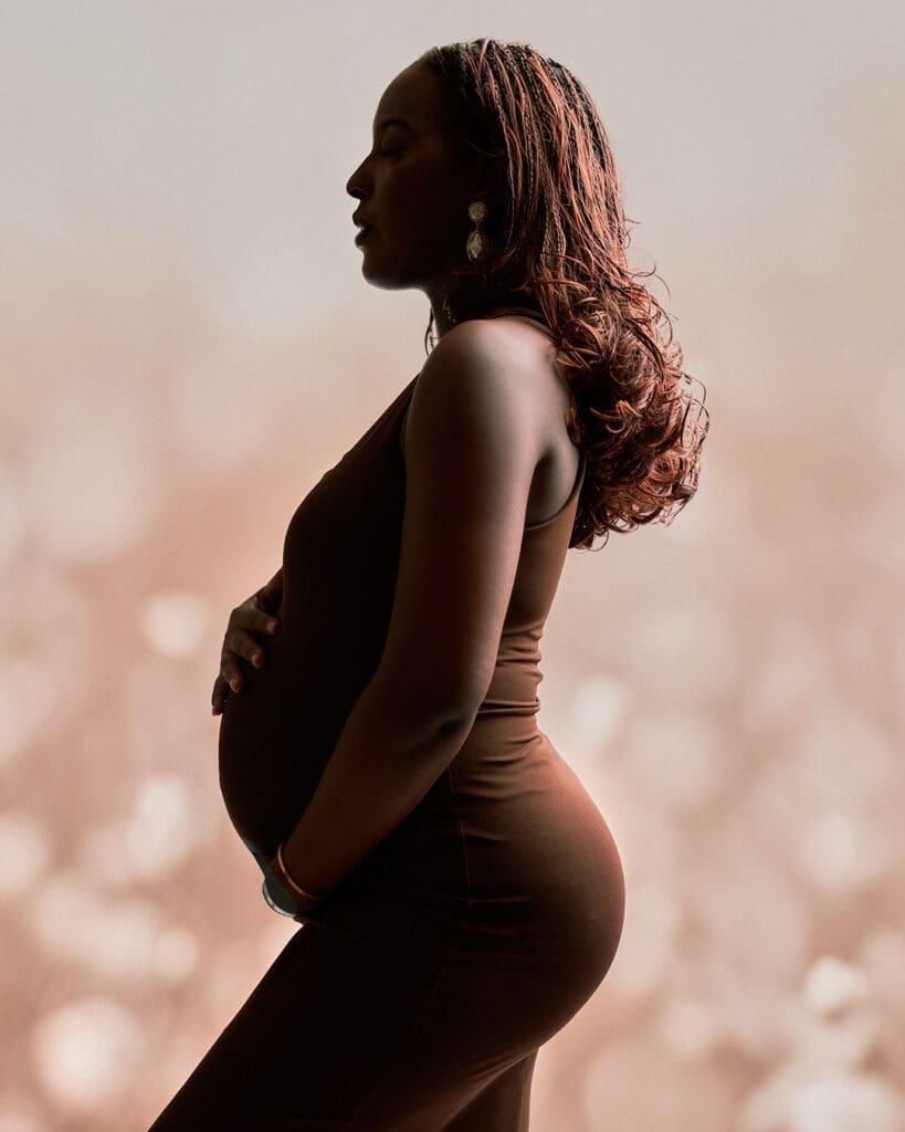 Elegant studio maternity photos in Phoenix with neutral tones and soft lighting