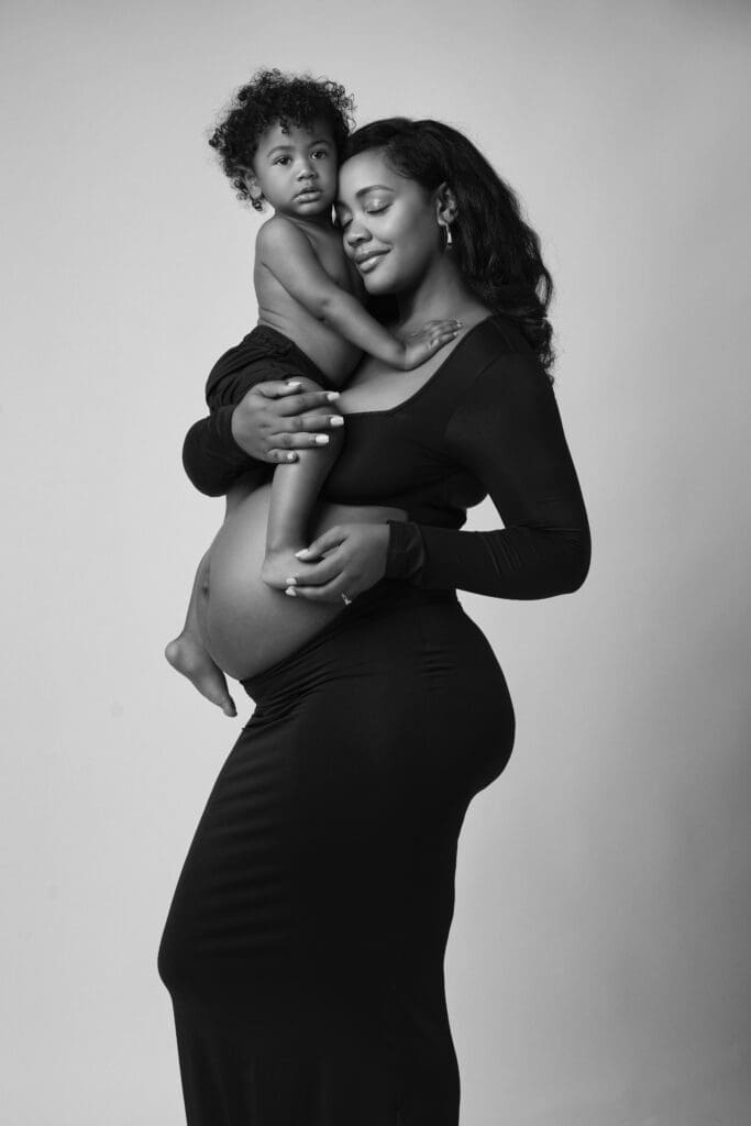 Mother smiling during guided maternity session in Phoenix