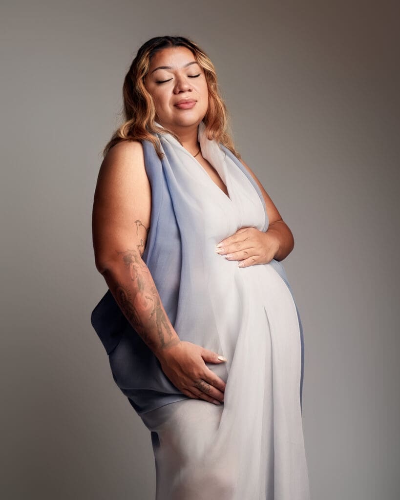 Elegant studio maternity portrait for a curvy mother in Scottsdale